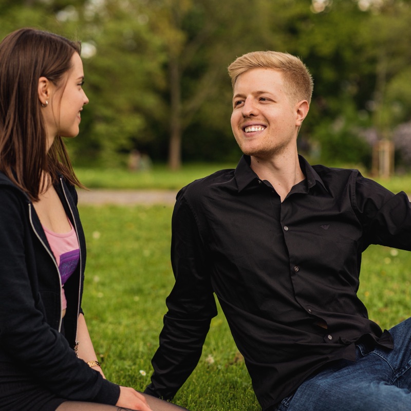 Master Nico and Jamie Young sharing a candid moment outdoors