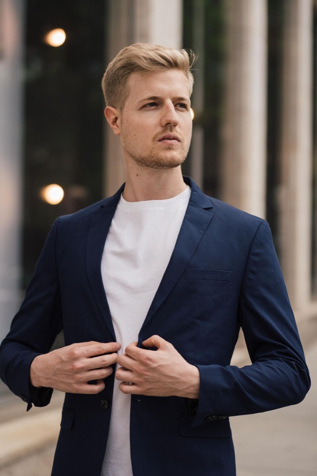 Master Nico in a navy blazer, official portrait