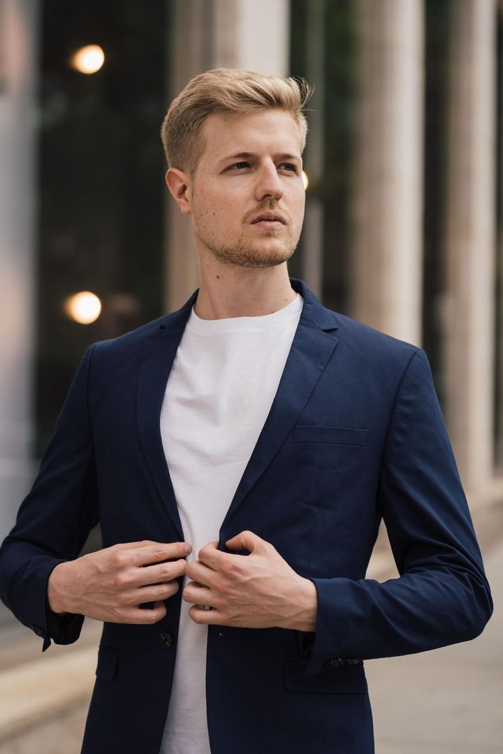 Official portrait of Master Nico in a navy blazer